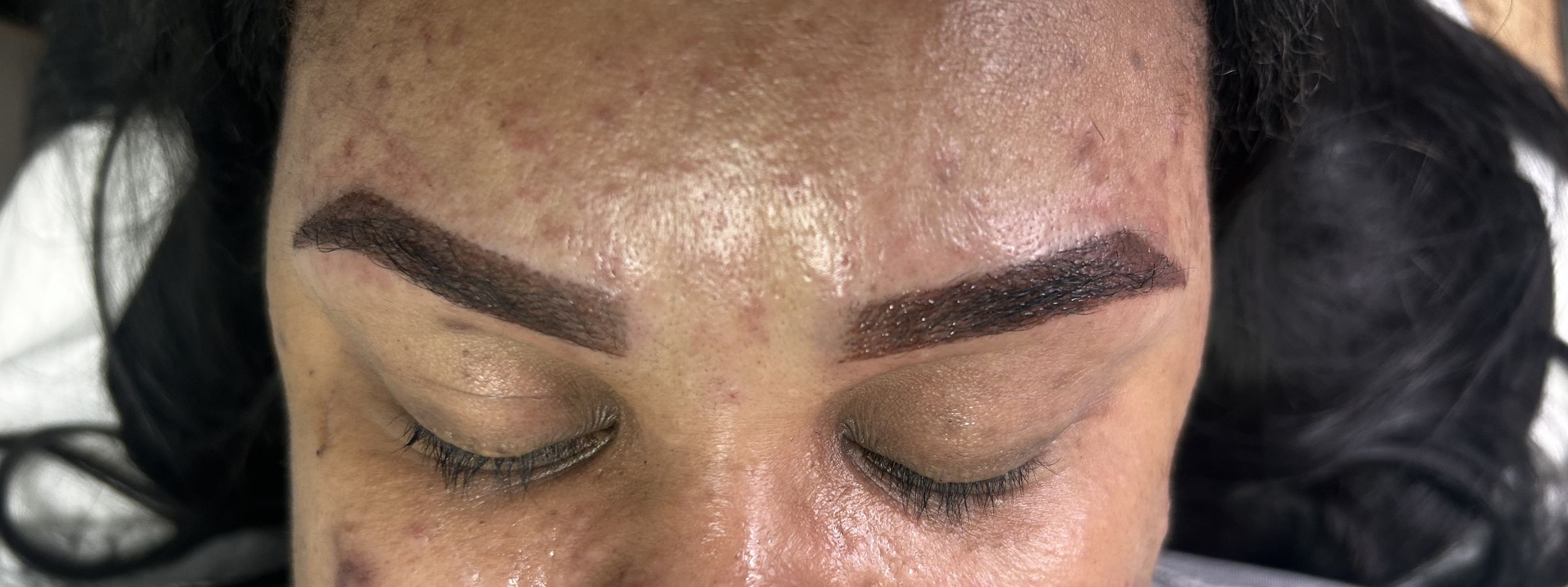A client after microshading with defined, powdered brows